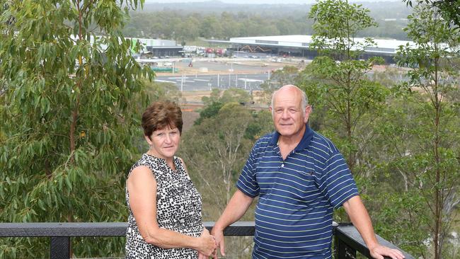 Moggil residents Mary and Keith Field opposite the Rheinmetall building site (foreground) which they claim is making their lives a misery. (AAP Image/Jono Searle)