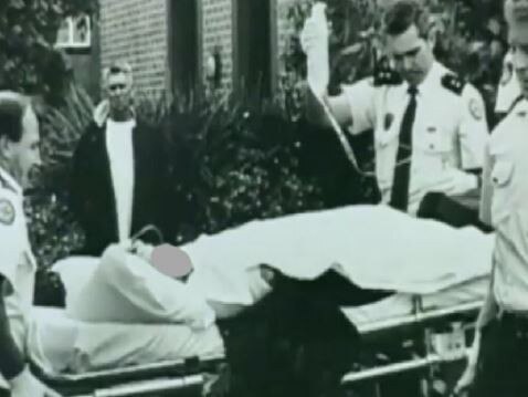 The woman, known only as JF, being treated by paramedics as she is wheeled out of Wyong Local Court after she was shot. Picture: supplied