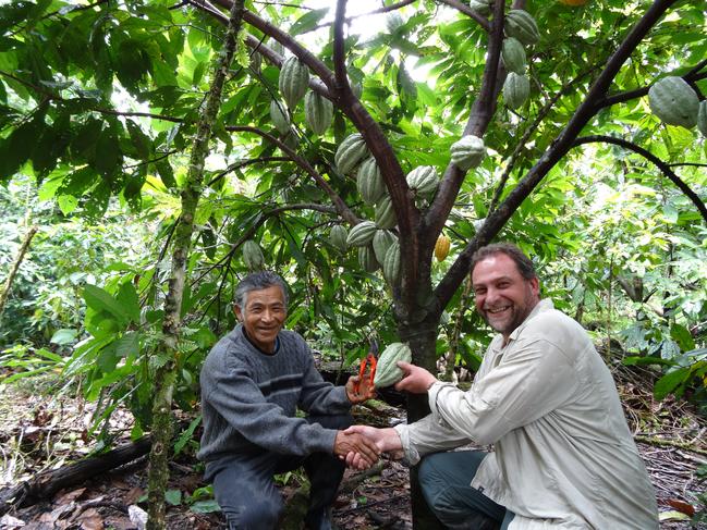 Igor Van Gerwen, right, in Peru with a cacao farmer.