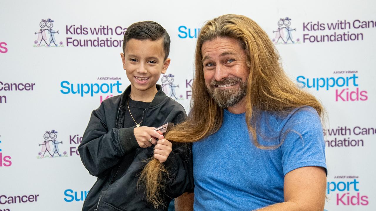 Nine-year-old Zai cut the first lock off farmer Dave Graham's hair for Kids with Cancer Foundations' Wigs 4 Kids on May 16, 2024. Photo: Supplied.