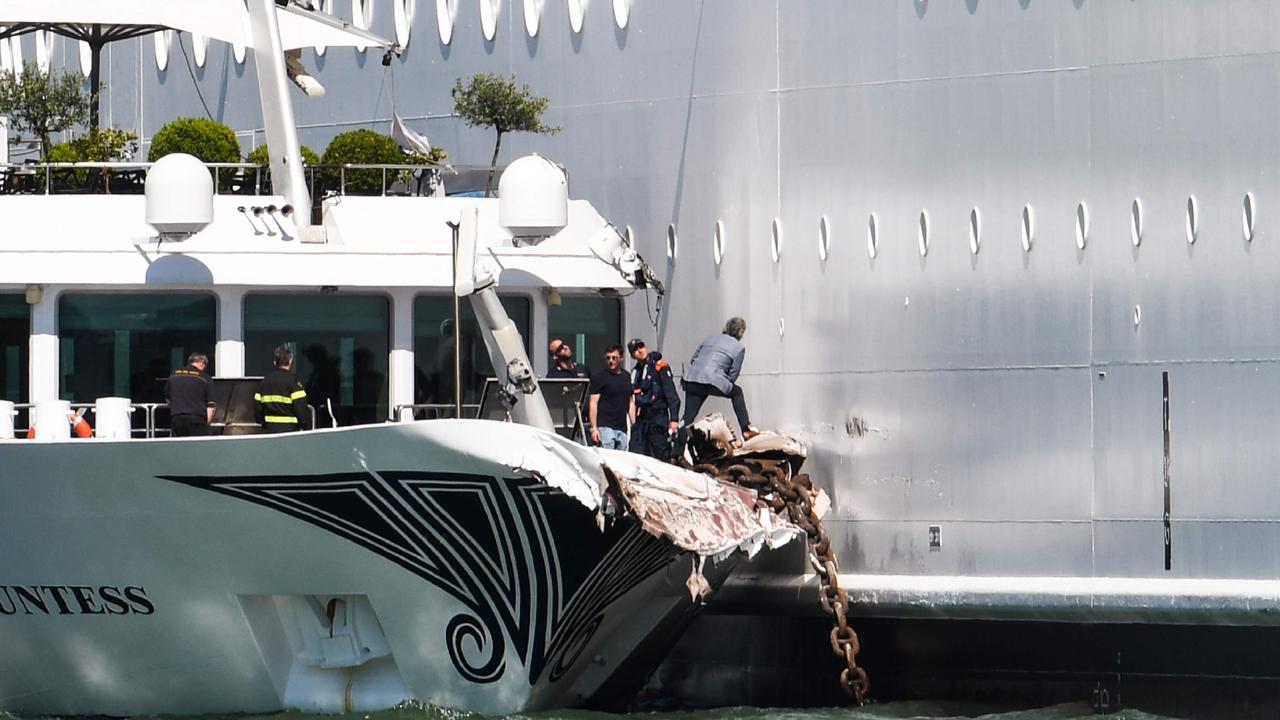 The damaged River Countess tourist boat alongside the MSC Opera. Picture: Andrea Pattaro / AFP