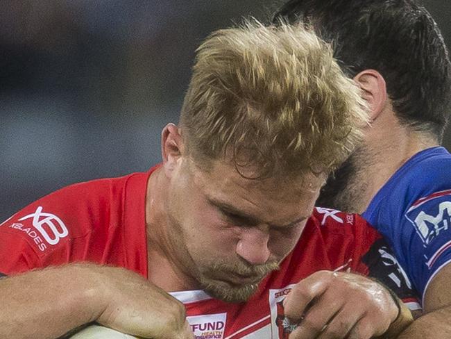 Jack de Belin of the Dragons is tackled during the Round 14 NRL match between the Canterbury-Bankstown Bulldogs and the St George-Illawarra Dragons at ANZ Stadium in Sydney, Monday, June 11, 2018. (AAP Image/Craig Golding) NO ARCHIVING, EDITORIAL USE ONLY