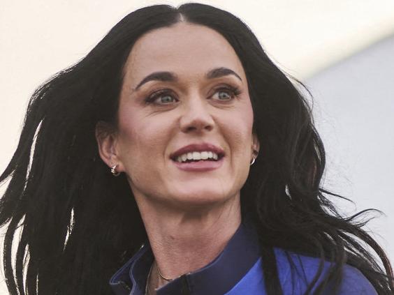 This handout photo from Blue Origin shows US singer Katy Perry upon return to Earth after a flight on Blue Origin New Shepard NS-31, which brought the passengers beyond the Karman line -- the internationally recognized boundary of space, in Van Horn, West Texas, April 14, 2025. Pop star Katy Perry completed a brief foray into space Monday, roaring to the edge of the cosmos with an all-women crew on one of billionaire Jeff Bezos's rockets. The 