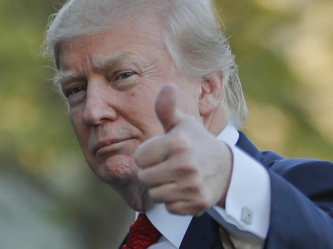 DAY 80 - In this April 9, 2017, file photo, President Donald Trump gives a thumbs-up as he walks across the South Lawn of the White House in Washington, as he returns from a trip to his Mar-a-Lago estate in Palm Beach, Fla. (AP Photo/Pablo Martinez Monsivais, File)