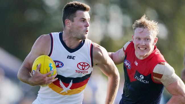 Adelaide’s Brad Crouch evades Melbourne’s Clayton Oliver. Picture: AAP Image/Michael Dodge