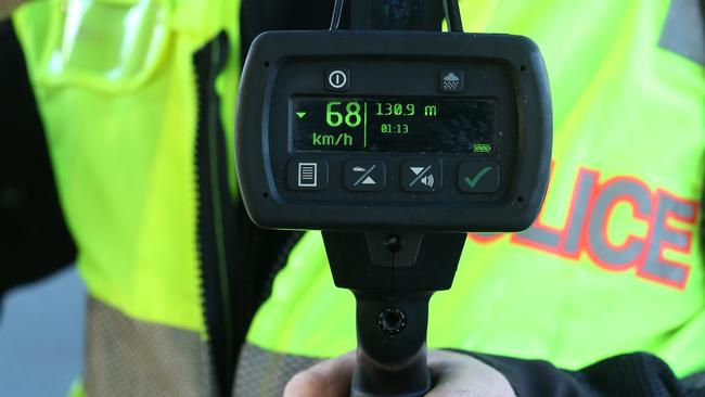 Acting Sergeant  Nick White shows the speed recorded on his speed camera at school zone during a traffic operation along the Gold Coast Highway near Miami State High School, Miami, Gold Coast. Photo: Regi Varghese