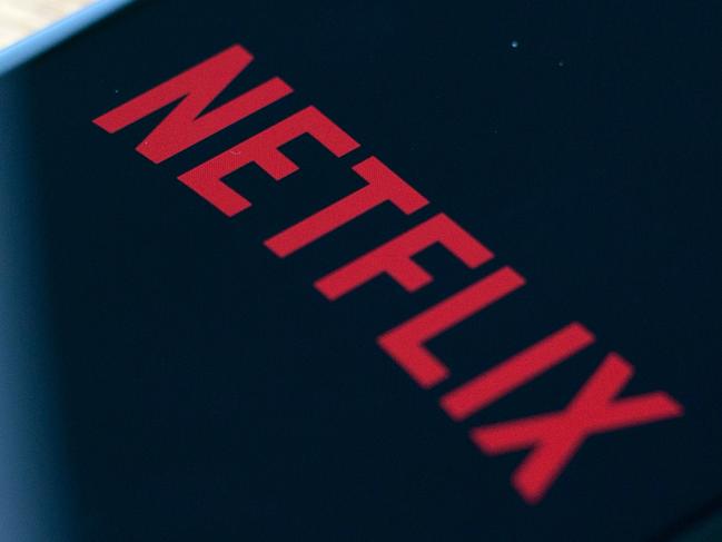 (FILES) In this file photo taken on July 10, 2019 the Netflix logo is seen on a phone in this photo illustration in Washington, DC. - Netflix said jANUARY 21, 2020 it added millions of new subscribers globally over the past quarter as it prepared up for a tougher competitive landscape, but scaled back its outlook for early 2020. The global television streaming giant beat expectations with a profit of $587 million in the fourth quarter of 2019 as revenue rose 31 percent from a year ago to $5.5 billion. (Photo by Alastair Pike / AFP)