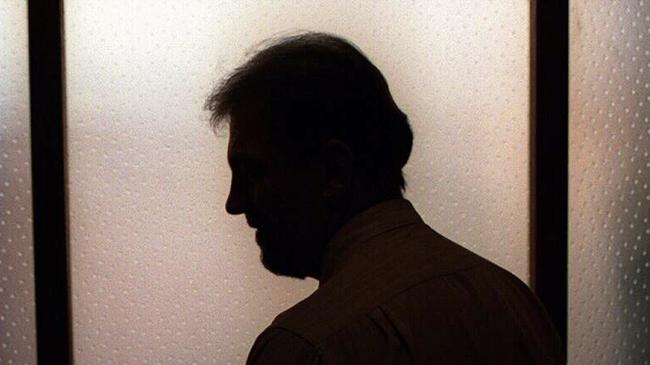 Generic image. Silhouette of a man (parent of) a sex abuse victim in an office. wrongly accused of touching young girl. Child sexual abuse. sex crime incest paedophilia.