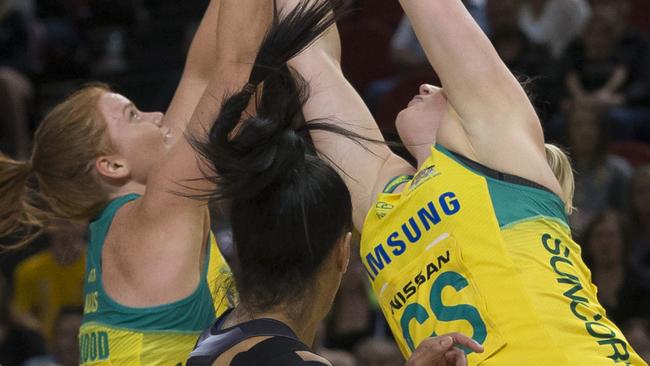 Stephanie Wood and Caitlin Thwaites go up for the ball during the netball Constellation Cup against New Zealand last year.