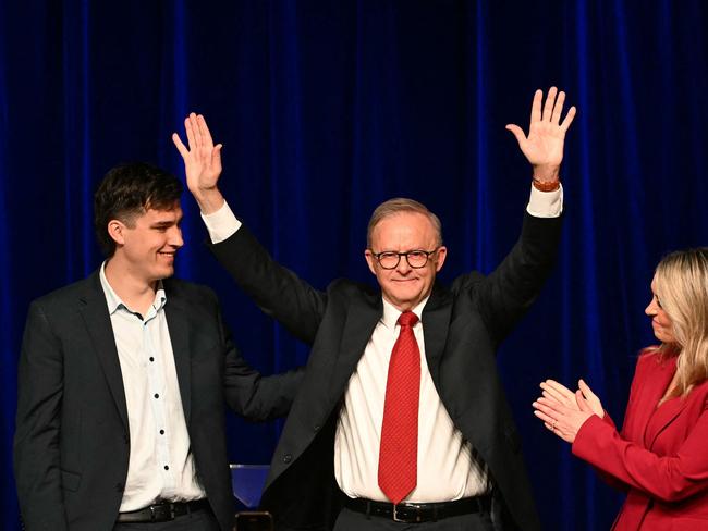 Australia's Prime Minister Anthony Albanese celebrates with his partner Jodie Haydon and son Nathan after winning the general election. (Photo by Saeed KHAN / AFP)