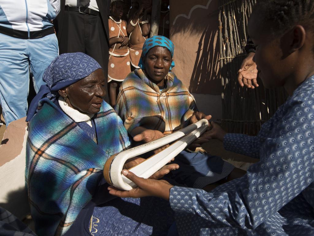 The Queen’s Baton travelled 500 kilometres north from Gaborone on 2 May, 2017, where it took part in a visit to a school Letlhakane. Photograph shows a pupil at the Supang Memorial Primary School handing the Baton to the wife of a local chief.