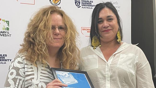 Katharina Fehringer (right) receiving the NT Writers Centre Poetry Award and a $1000 prize for her entry ‘Honey’. Picture: Jasmin Afianos