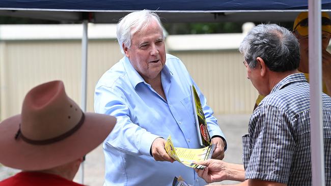 Clive Palmer handing out how-to-vote cards during the Queensland state election campaign. Picture: Lyndon Mechielsen