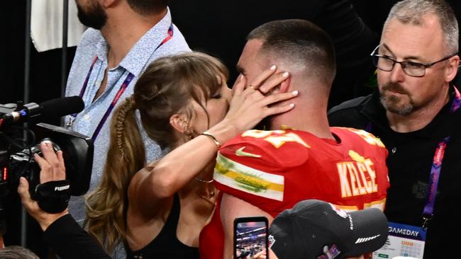 Taylor Swift and Travis Kelce celebrate after the Super Bowl. (Photo by Patrick T. Fallon / AFP)