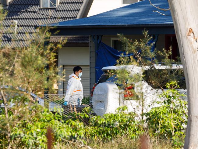 Forensic officers at the Blue Mountains home on Wednesday morning. Picture: Max Mason-Hubers