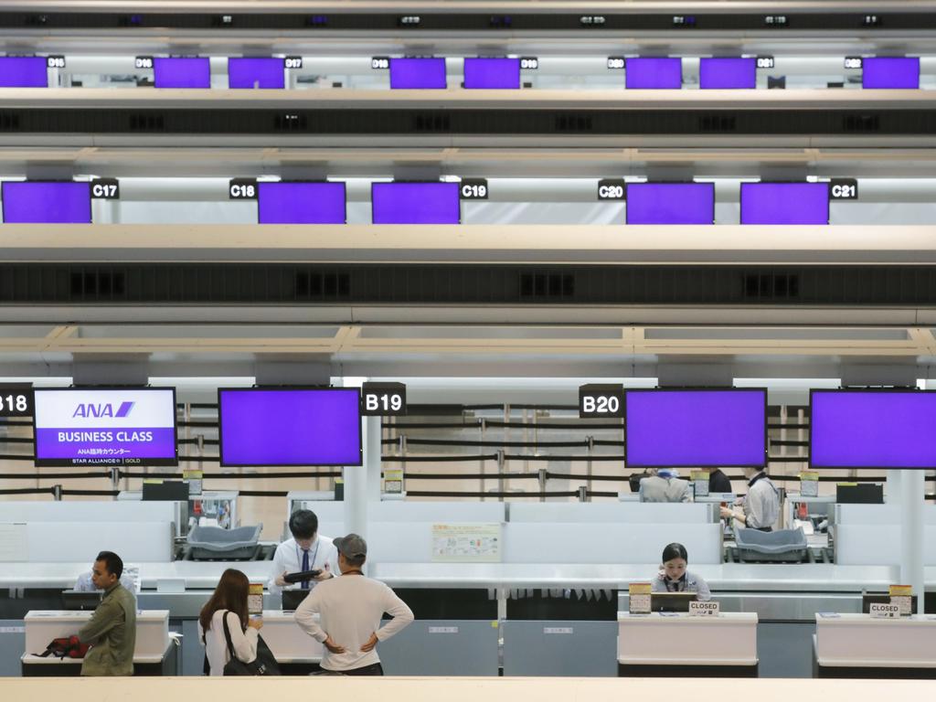 Deserted check-in counter at Narita international airport. Picture: AP