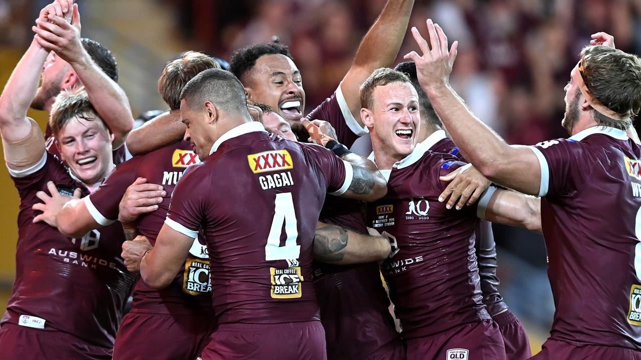 Queensland players celebrate victory.