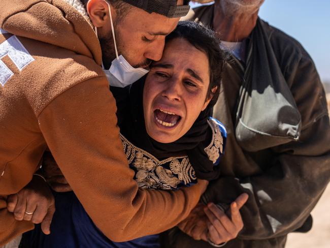 A woman is overcome with grief as the body of her husband is removed from a collapsed house in Morocco. Nearly 3000 people were reported to have died following the large earthquake that struck in the High Atlas Mountains, south of Marrakesh. Picture: Carl Court/Getty Images