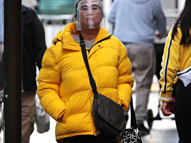 People have been wearing masks and face shields in Sydney. Photographer: Adam Yip