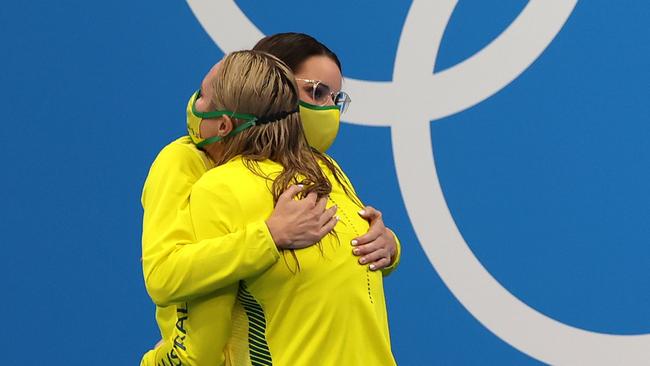 TOKYO, JAPAN - JULY 31: Gold medalist Kaylee McKeown of Team Australia and bronze medalist Emily Seebohm of Team Australia embrace on the podium during the medal ceremony for the Women's 200m Backstroke Final at Tokyo Aquatics Centre on July 31, 2021 in Tokyo, Japan. (Photo by Al Bello/Getty Images)