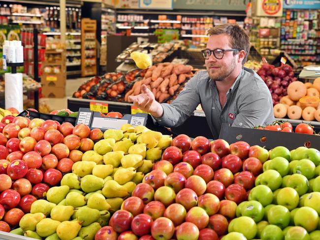 14/03/17 - Hahndorf IGA store manger Tom Ratcliffe restocking the fresh produce section.Picture: Tom Huntley