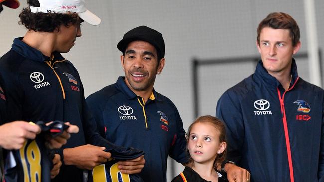 Eddie Betts of the Crows is seen with Iella Warrior after handing out indigenous guernseys with indigenous school children at the Adelaide Football Club headquarters at West Lakes. Picture: AAP Image/David Mariuz                        <a capiid="8d9eafcde2a0153a5626e7524a3d2235" class="capi-video">'My guys ran around topless'</a>