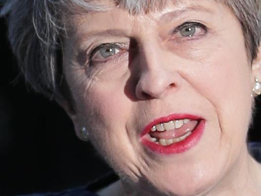 British Prime Minister Theresa May speaks to the media outside 10 Downing Street in central London on April 18, 2017. British Prime Minister Theresa May has called for an early general election. / AFP PHOTO / Daniel LEAL-OLIVAS