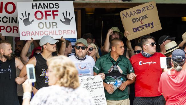 Protestors link arms outside Bar Wunder during the Saturday afternoon protest in a showing of support for the venue’s management. Picture: Kevin Farmer