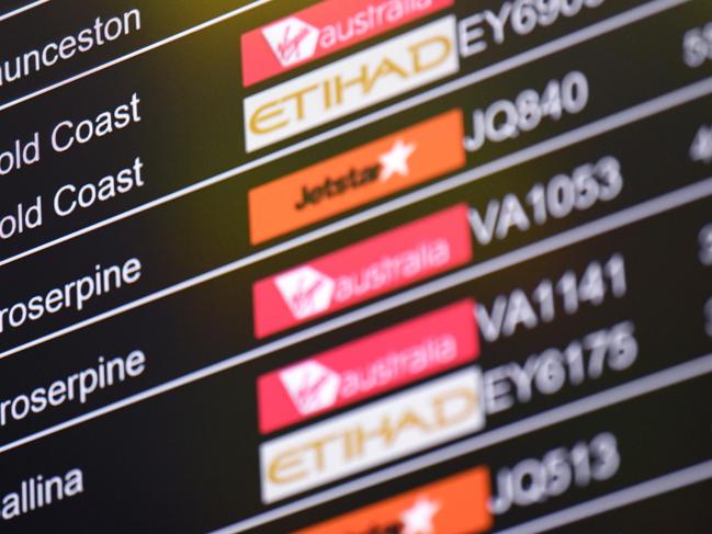 SYDNEY, AUSTRALIA - NCA NewsWire Photos JANUARY, 28, 2021: A flight departure board showing flights to Queensland cities is seen at Sydney Domestic Airport, Sydney. Queensland has announced that it will open its border to NSW on February 1, with Greater Sydney no longer being declared a COVID-19 hotspot. Picture: NCA NewsWire/Bianca De Marchi