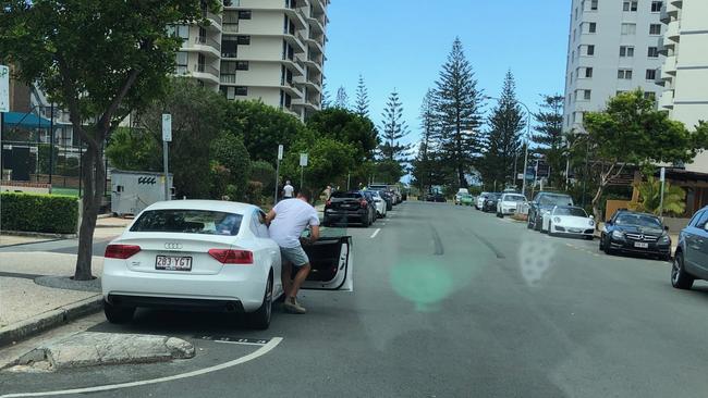 Unlicensed builder Adrian Hill leaving the Niecon Plaza after a homeowner saw him in an office there. Photo: Supplied 