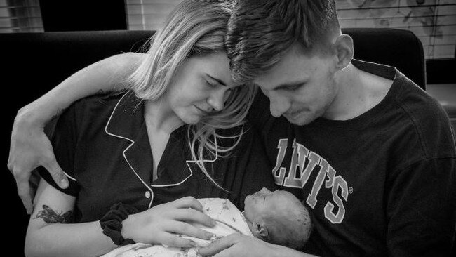 Meg Flaskett, 21, and James Flaskett, 22, holding their baby daughter, Thea. Photo: Supplied.