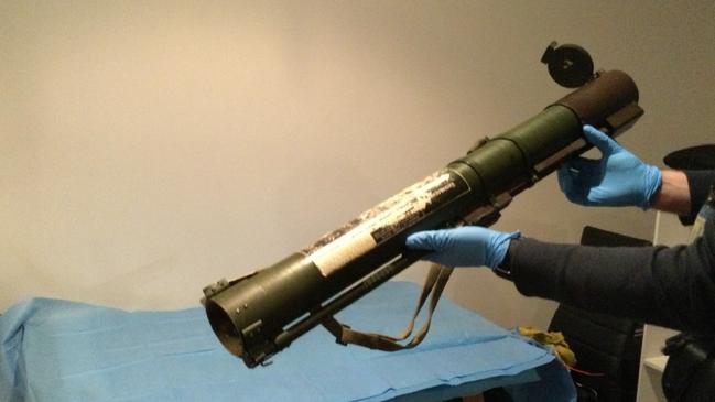 A cache of high-grade weapons including a grenade launcher, remote-control bombs, ballistic vests, knuckle dusters and throwing knives have been found inside a St Kilda Rd apartment. Picture: Victoria Police.