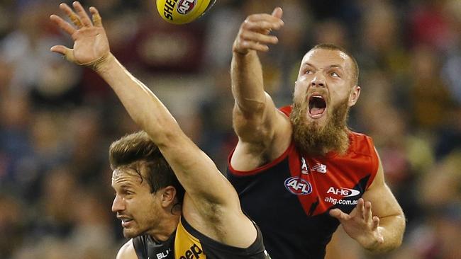 Max Gawn wins the centre bounce tap over Ivan Maric. Picture: Michael Klein