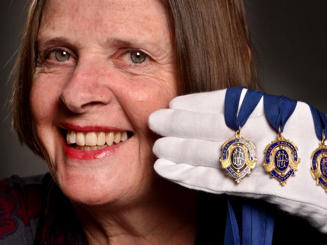 Suzie Horman with her father Dick Reynolds’ Brownlow medals before the 2017 auction. Picture: Jay Town