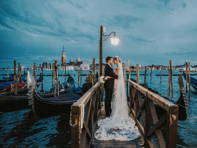 Natalie Watts from Natalie J Weddings took her photo of this loved-up couple on a pier in Venice, Italy.