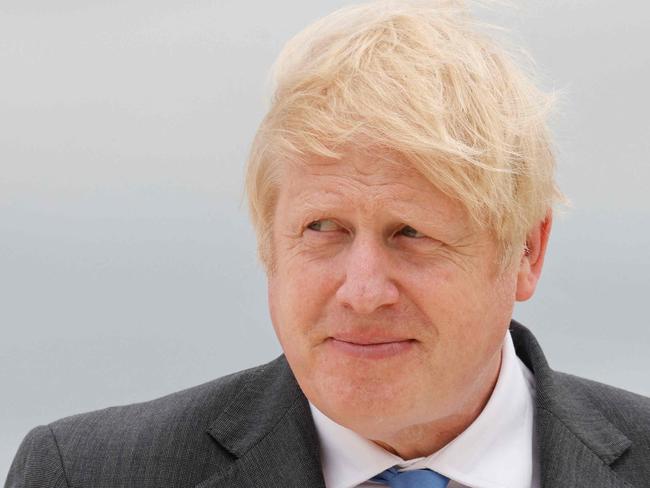 Britain's Prime Minister Boris Johnson waits to greet guests prior to the start of the G7 summit in Carbis Bay, Cornwall on June 11, 2021. - G7 leaders from Canada, France, Germany, Italy, Japan, the UK and the United States meet this weekend for the first time in nearly two years, for three-day talks in Carbis Bay, Cornwall. (Photo by Ludovic MARIN / AFP)