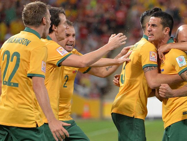 BRISBANE, AUSTRALIA - JANUARY 22: Tim Cahill of Australia celebrates with team mates after scoring a goal during the 2015 Asian Cup match between China PR and the Australian Socceroos at Suncorp Stadium on January 22, 2015 in Brisbane, Australia. (Photo by Bradley Kanaris/Getty Images)