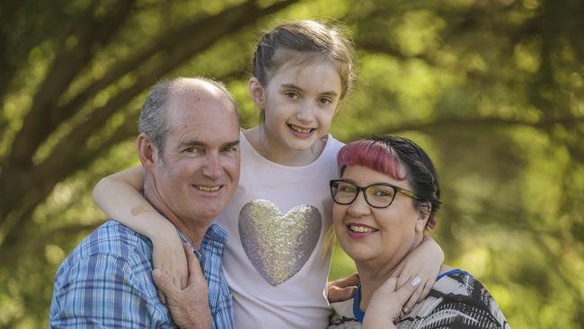 Adelaide-born Abigail Baker, 8, with parents Scott and Kylie had to undergo life-saving surgery in Melbourne when she was 18 days old. Picture: Roy Van Der Vegt