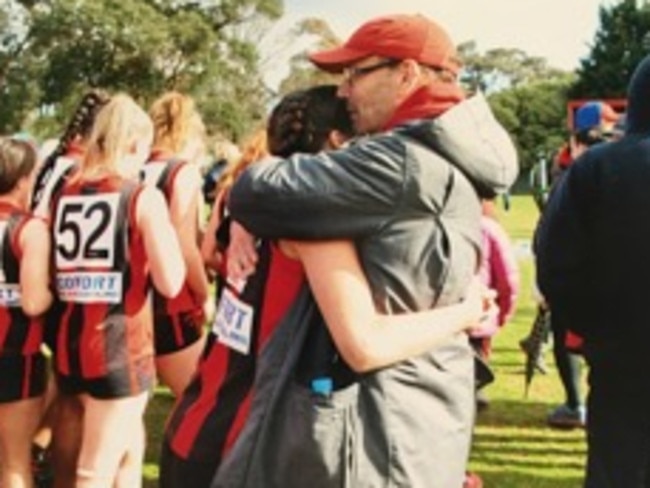 Tim and Hannah Jacobs embrace after last year’s grand final.