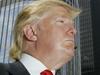 Real estate mogul Donald Trump is profiled against his 92-story Trump International Hotel & Tower during a news conference on construction progress in Chicago, Thursday, May 24, 2007. (AP Photo/Charles Rex Arbogast)
