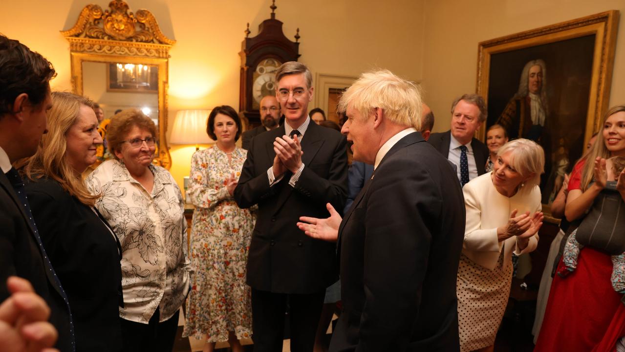 The Prime Minister Boris Johnson is greeted by staff and his son Wilfred as he arrives back into No 10 after delivering his resignation speech. Picture: No 10 Downing Street