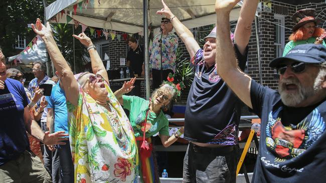 Dancing in the street at Wayside Chapel Christmas lunch. Picture: Dylan Robinson