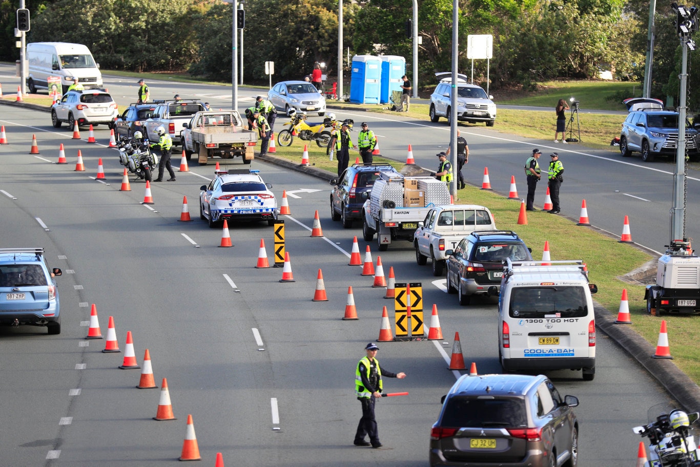 Queensland Police set up a road block due to the Corona Virus at the NSW / Queensland Border on the old Pacific Highway at Coolangatta. Photo: Scott Powick Newscorp