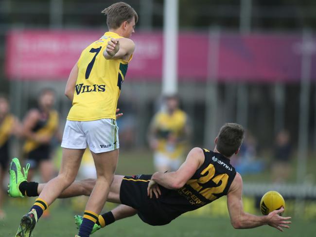 SANFL: Glenelg v Eagles at Glenelg Oval 23 June 2018. Glenelg's Chris Curran attempting to mark in front of Eagle's Nicholas Hayes. (AAP Image/Dean Martin)