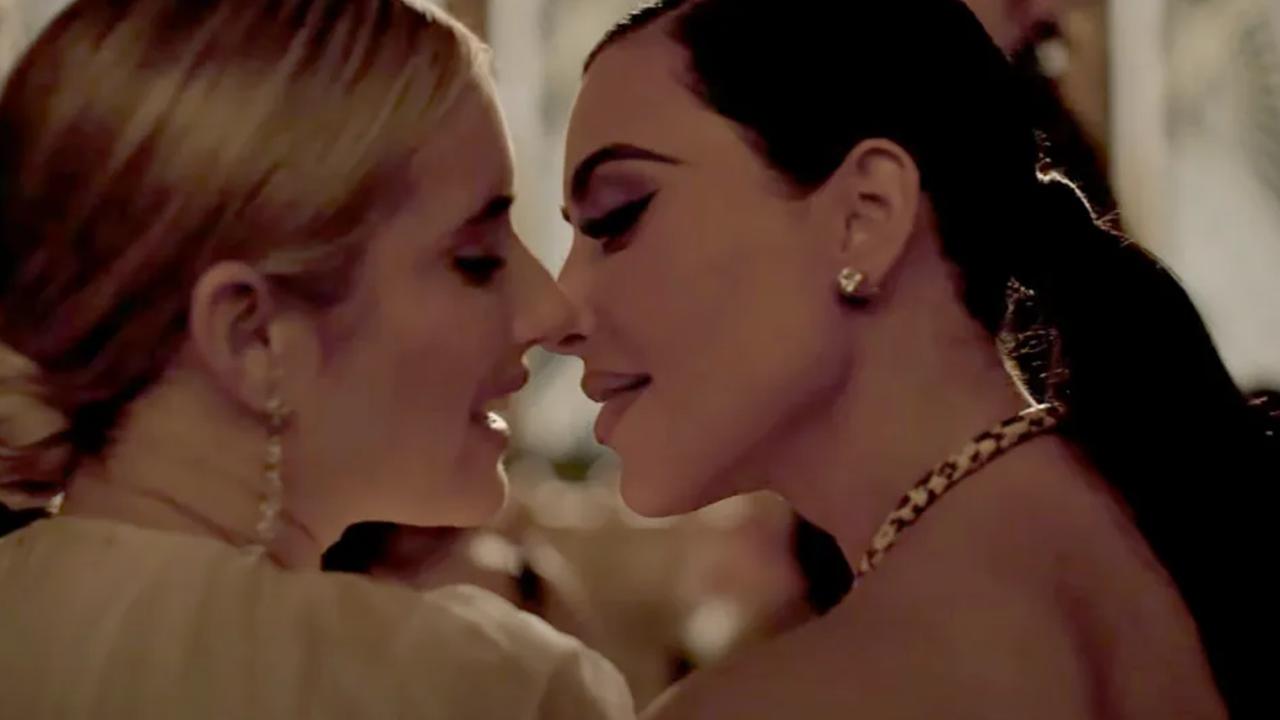 Kim Kardashian shares a kiss with Emma Roberts in the new season of AHS. Picture from YouTube.