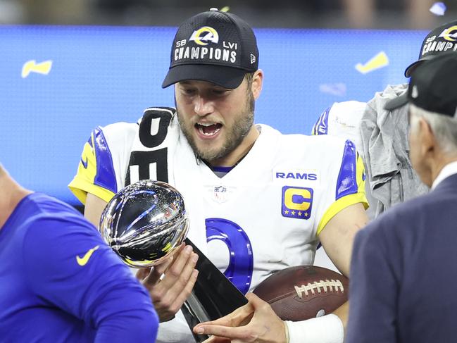 INGLEWOOD, CALIFORNIA – FEBRUARY 13: Matthew Stafford #9 of the Los Angeles Rams reacts as he holds the Vince Lombardi Trophy after the win against the Cincinnati Bengals following the NFL Super Bowl 56 football game at SoFi Stadium on February 13, 2022 in Inglewood, California. The Rams won 23-20. (Photo by Michael Owens/Getty Images)