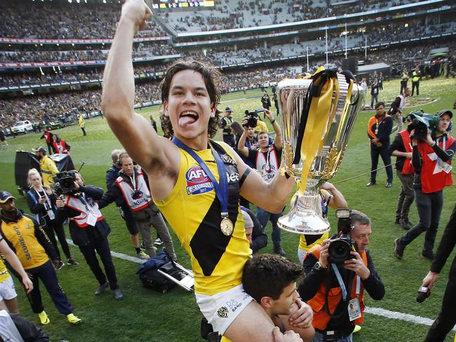 Daniel Rioli celebrates on Trent Cotchin’s shoulders. Picture: David Caird