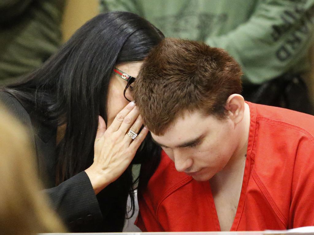 Assistant Public Defender Erin Veit, left, talks with school shooting suspect Nikolas Cruz. Picture: AP