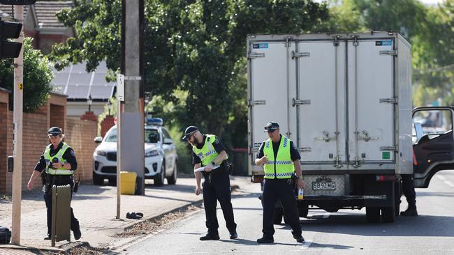 Police attend the scene of the incident in which two school students were seriously injured after being hit by a truck. Picture: NewsWire / David Mariuz