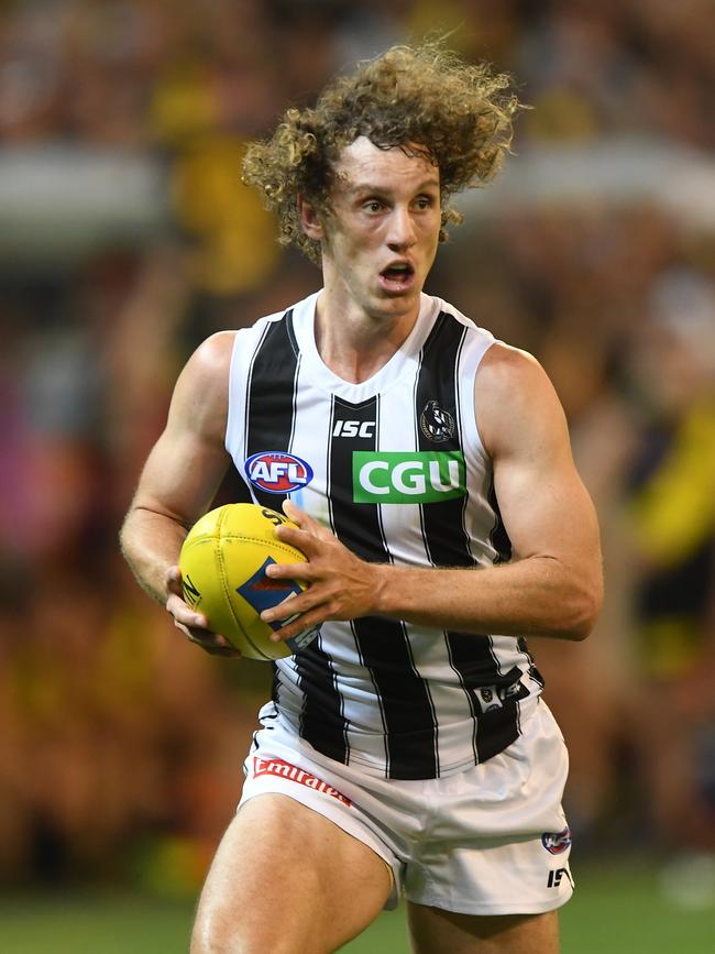 Chris Mayne dashes forward for Collingwood during Thursday’s win over Richmond. 